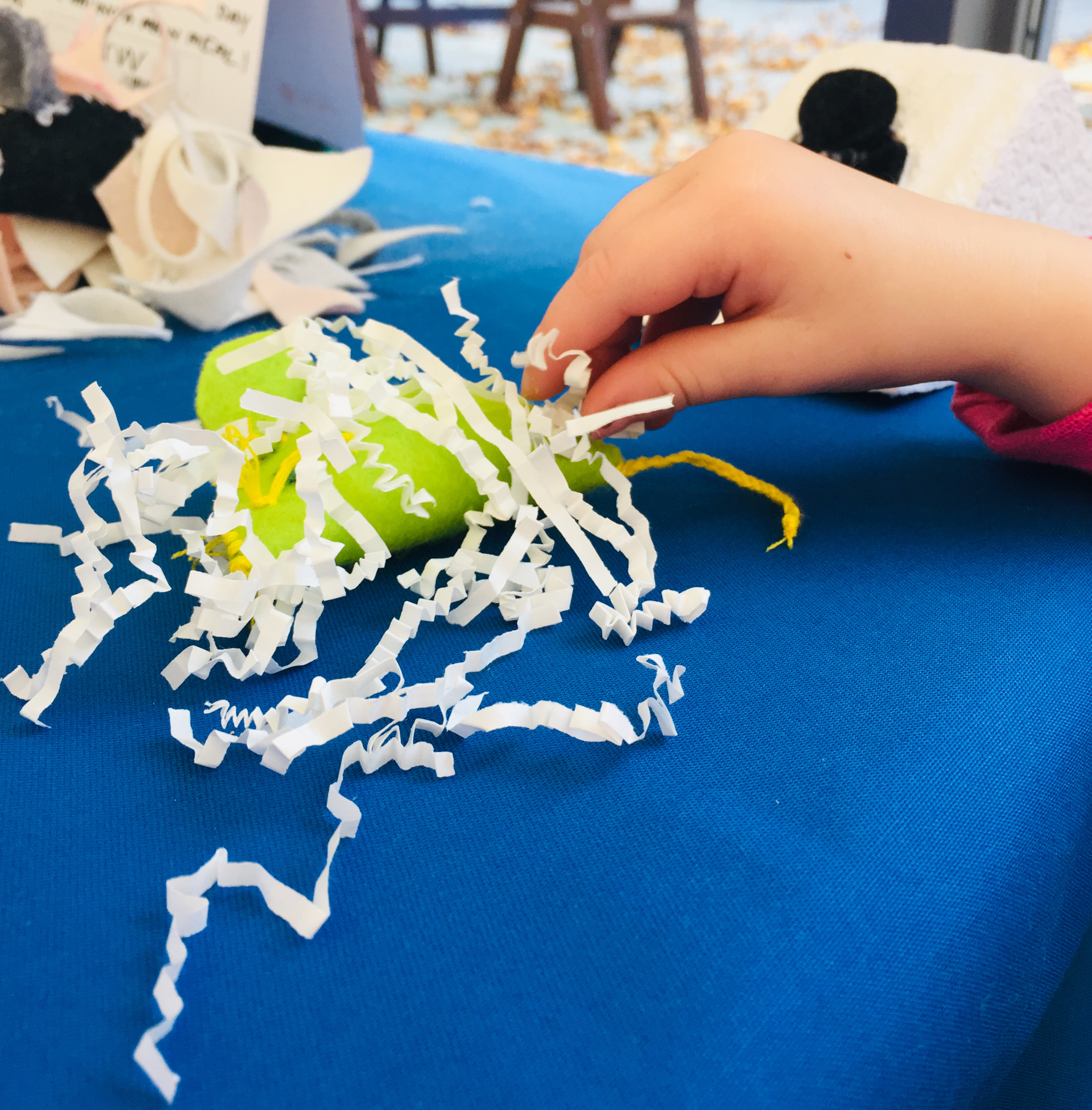 Enacting Care; a young participant puts a mouse to bed